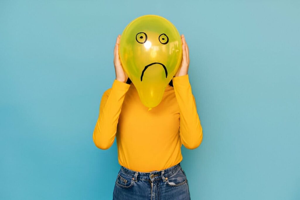 woman with a sad face on balloon