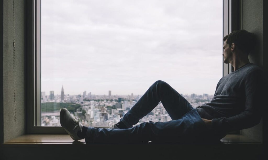 man sitting by the window