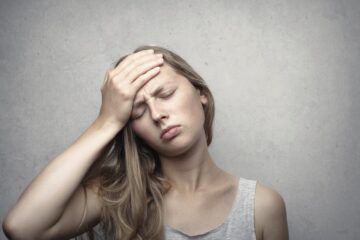 frustrated woman hand on forehead