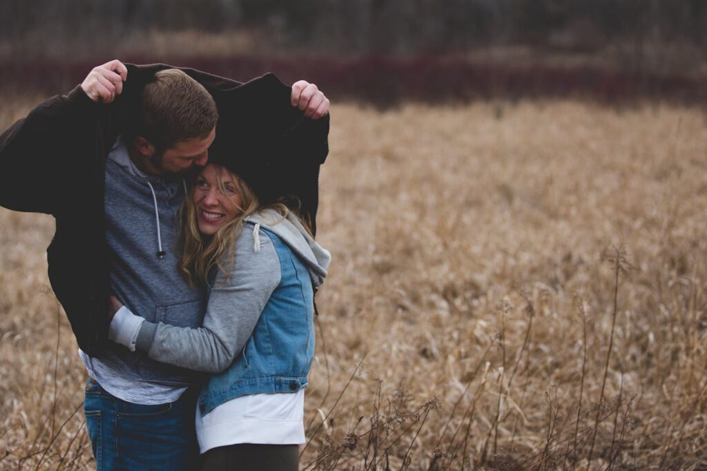 man covering a woman